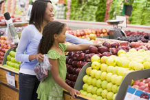 Mother and daughter shopping at grocery store